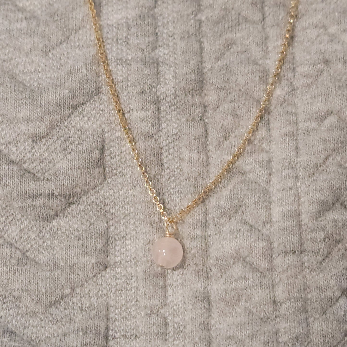 small 6mm rose quartz gemstone hanging from 14k gold filled rolo chain 