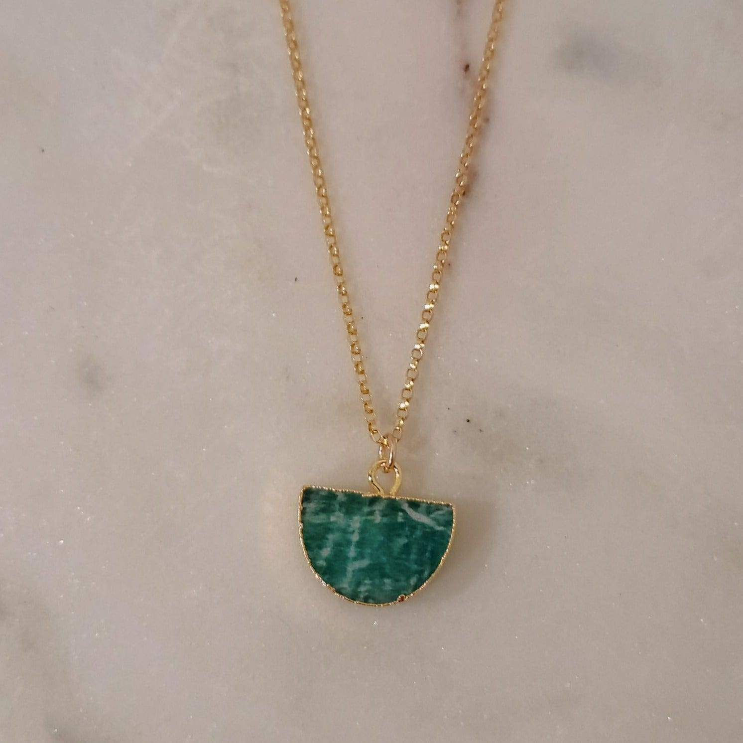 Seren and Skye gemstone necklace. Half circle amazonite, with gold electroplating hanging from a gold filled rolo chain