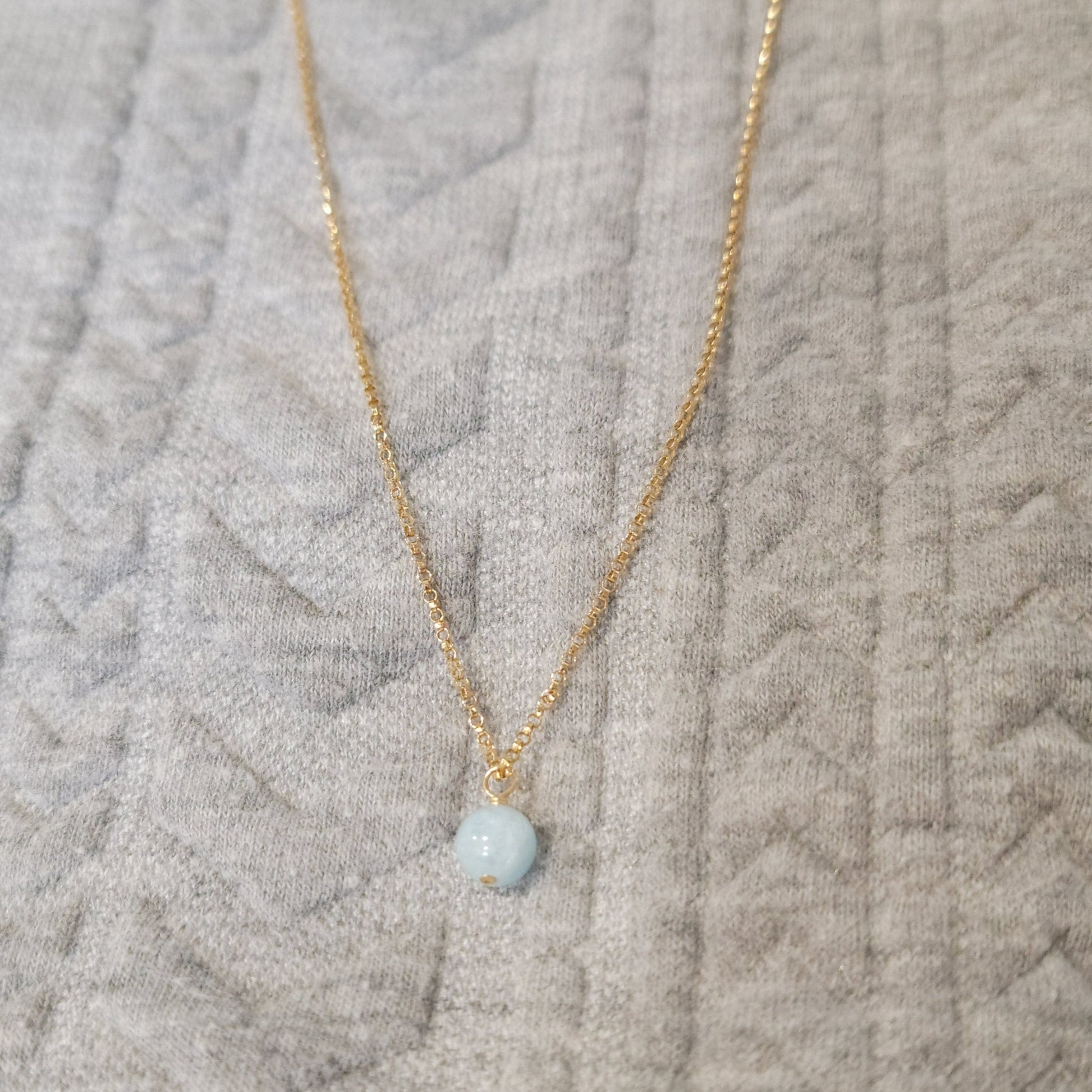 small 6mm aquamarine gemstone hanging from 14k gold filled rolo chain 